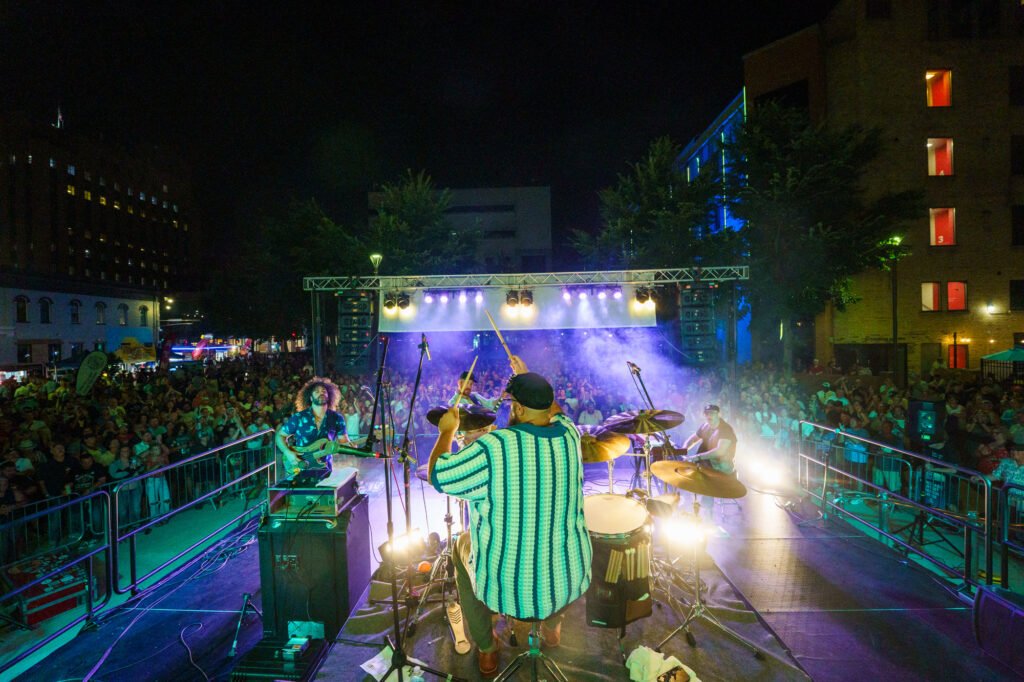 Wild Adriatic performing in the crowd at Mile of Music Festival