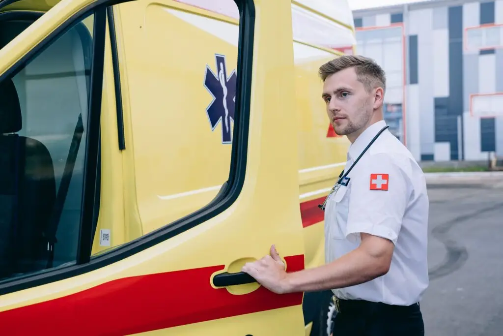 Paramedic team with ambulance